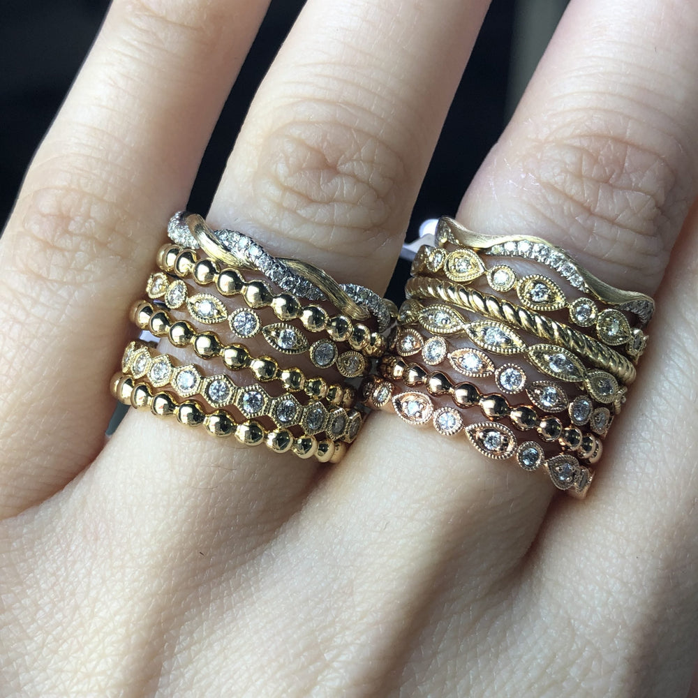 Gold and diamond rings styled in a stack