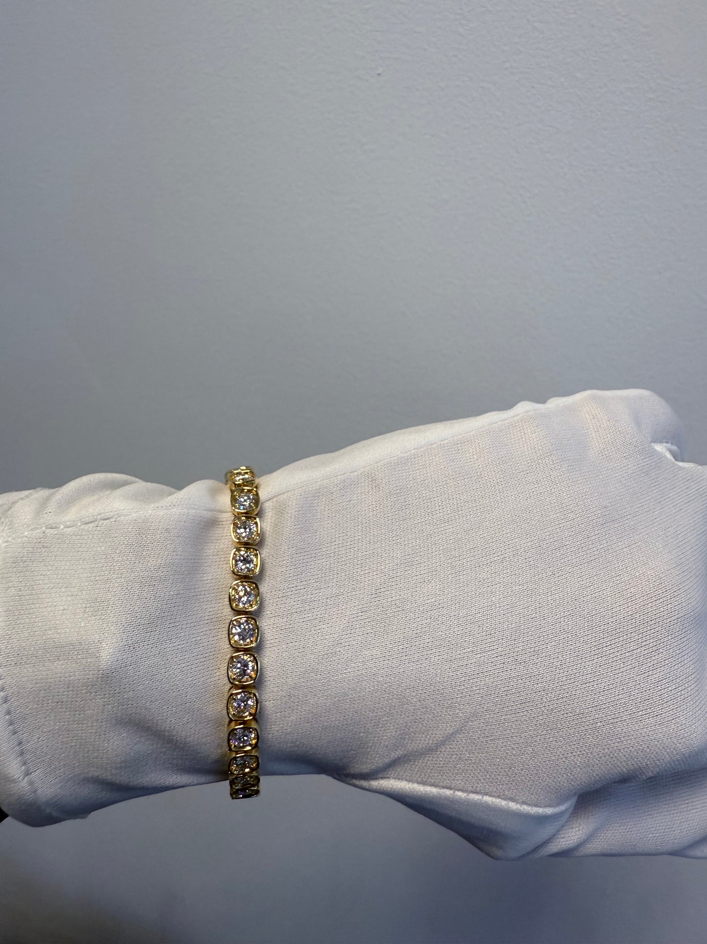 18K Yellow Gold Natural 6.60 Carats Round Brilliant Cut Tennis Bracelet in a Square Bezel Set