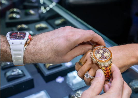 Luxury diamond watch being fitted on wrist in high-end jewelry store showroom