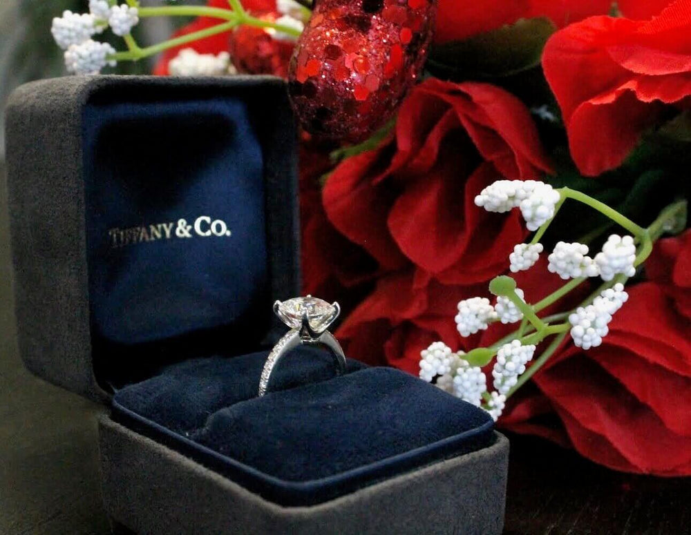 Tiffany ring presented with flowers