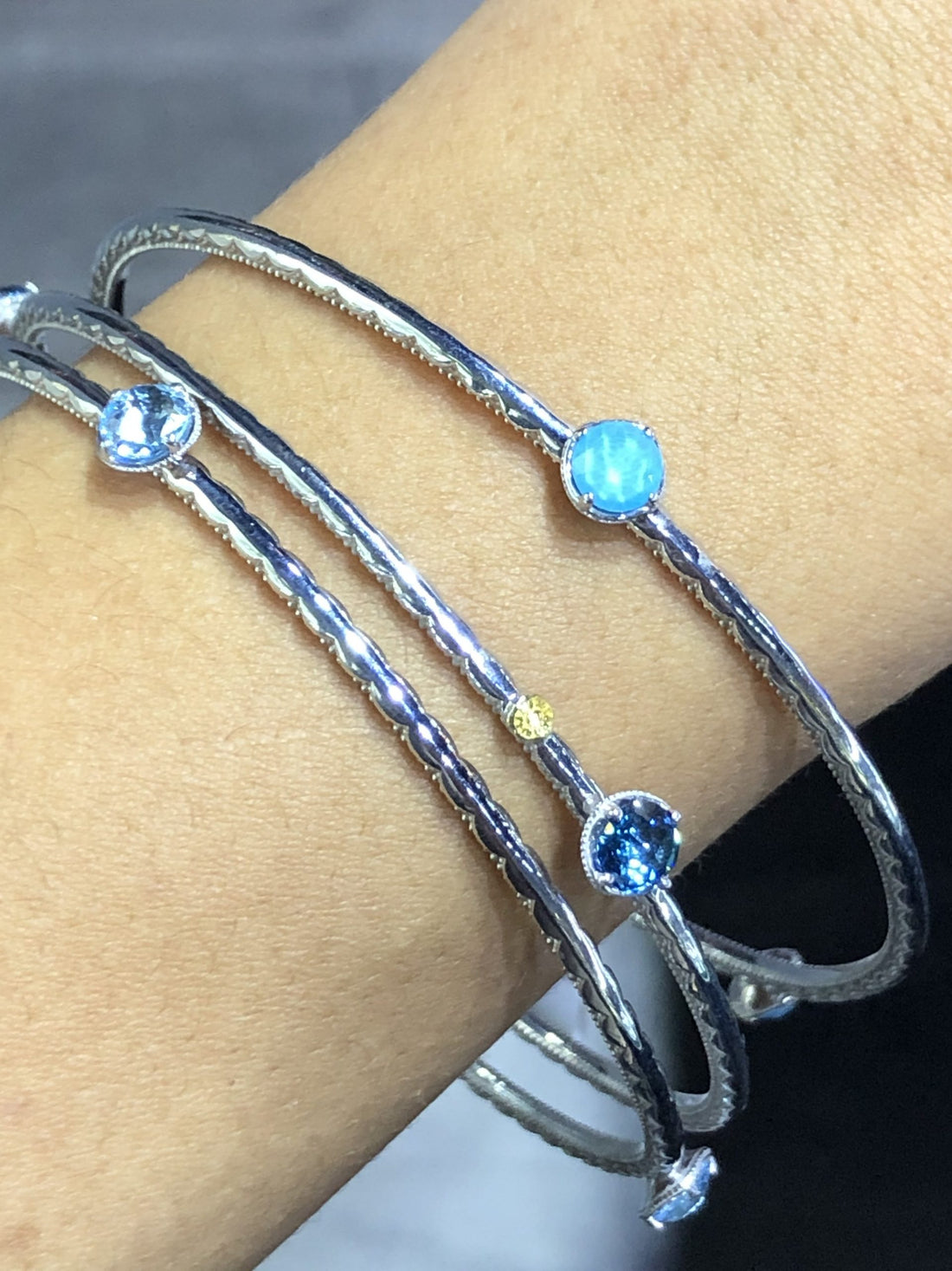 three blue Tacori bangles for White Jumpsuits