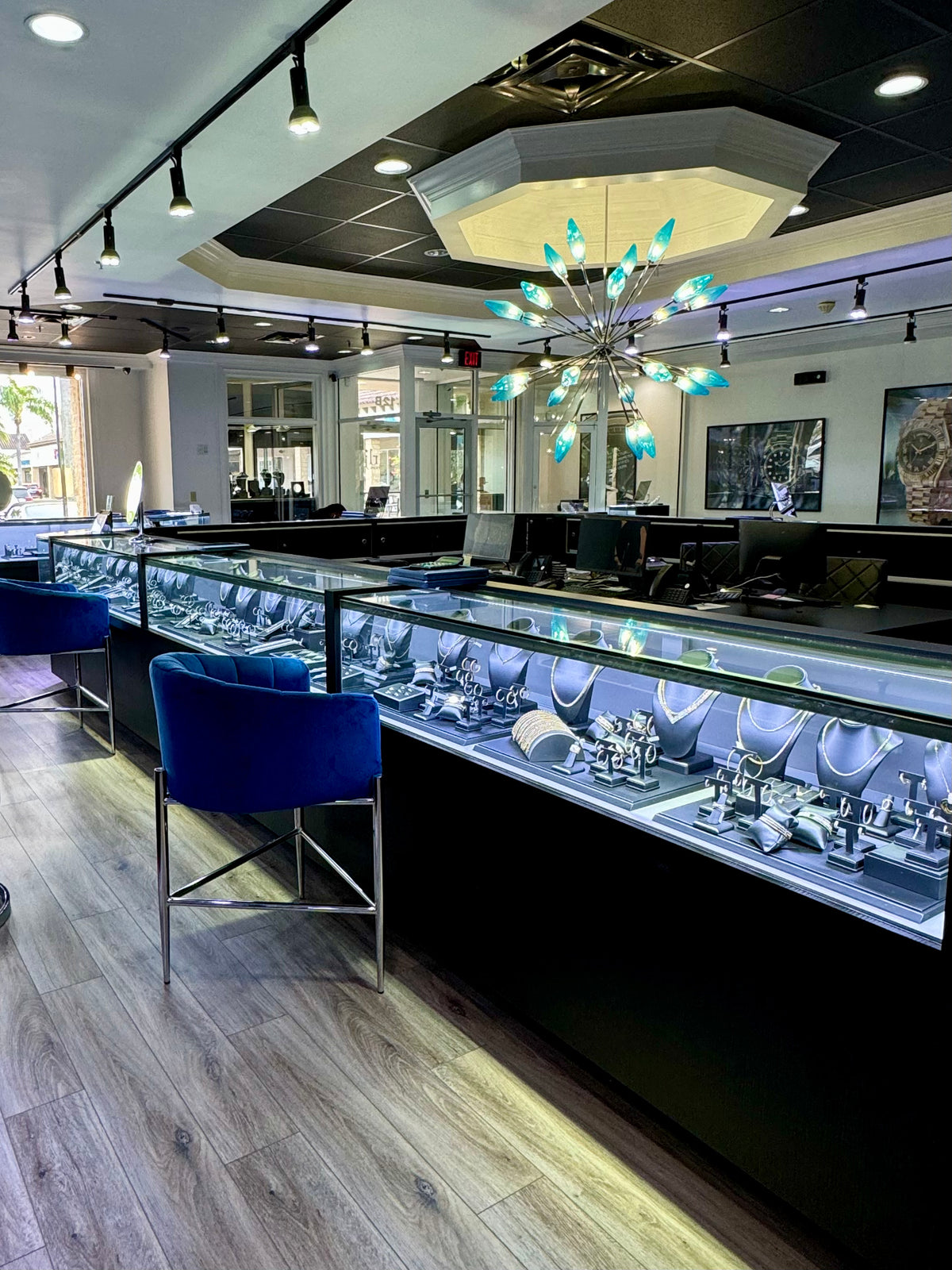 Jewelry display cases and seating inside the Raymond Lee Jewelers showroom