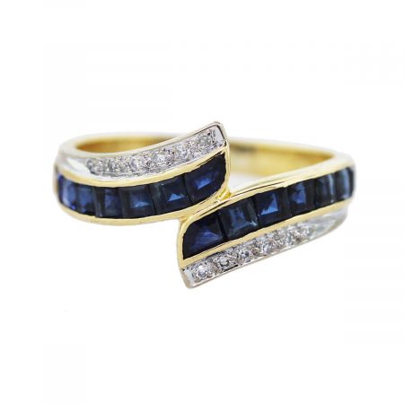 You are viewing this 18k Yellow Gold, Diamond and Sapphire Bypass Ring!