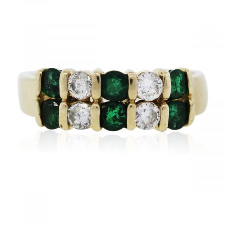 You are viewing this yellow gold emerald and diamond ring!