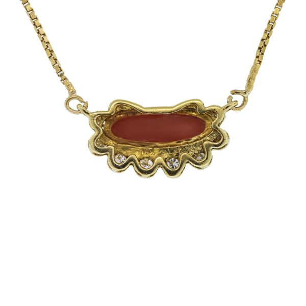 This 18kt Yellow Gold Cabochon Coral and Diamond Necklace is cute