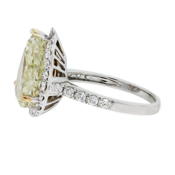 You'll love this 18k White Gold Pear Shape Fancy Yellow Diamond Halo Engagement Ring