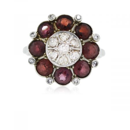 You are viewing this 18k White Gold Round Garnet Diamond Cocktail Ring!