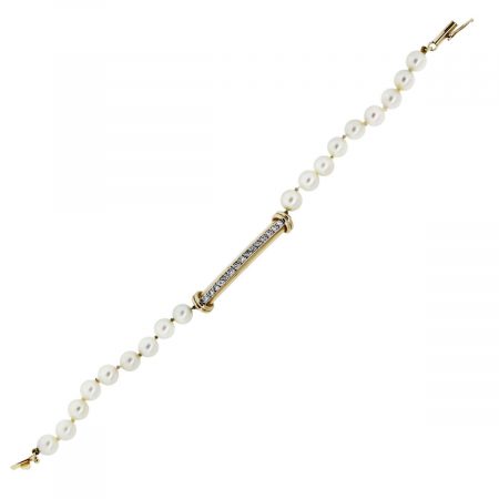 You are viewing this 14k Yellow Gold Pearl and Diamond Bracelet!