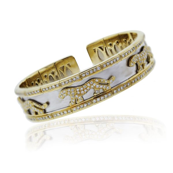You are viewing this 18k Two Tone Gold and Diamond Panther Design Bangle Bracelet!