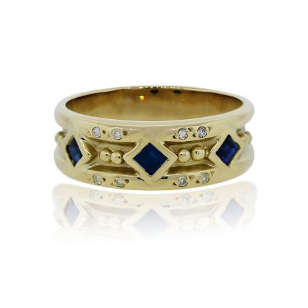 You are viewing this 18k Yellow Gold Princess Cut Sapphire and Diamond Cocktail Ring!