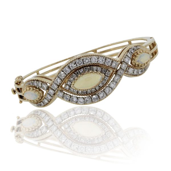 You are viewing this 14k Yellow Gold Diamond Opal Bangle Bracelet!