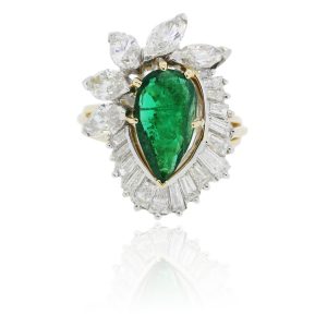 Emerald platinum and gold and diamond ring