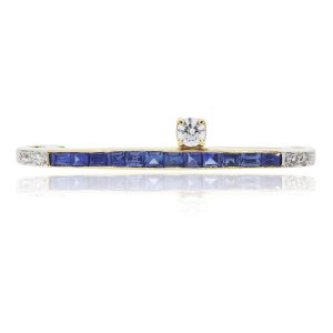 You are viewing this 14k Yellow Gold Blue Sapphire and Diamond Bar Pin!