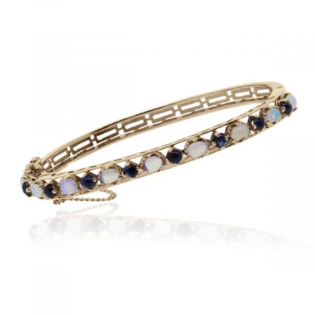 You are viewing this 14k Rose Gold Cabochon Opal & Blue Stone Bangle!