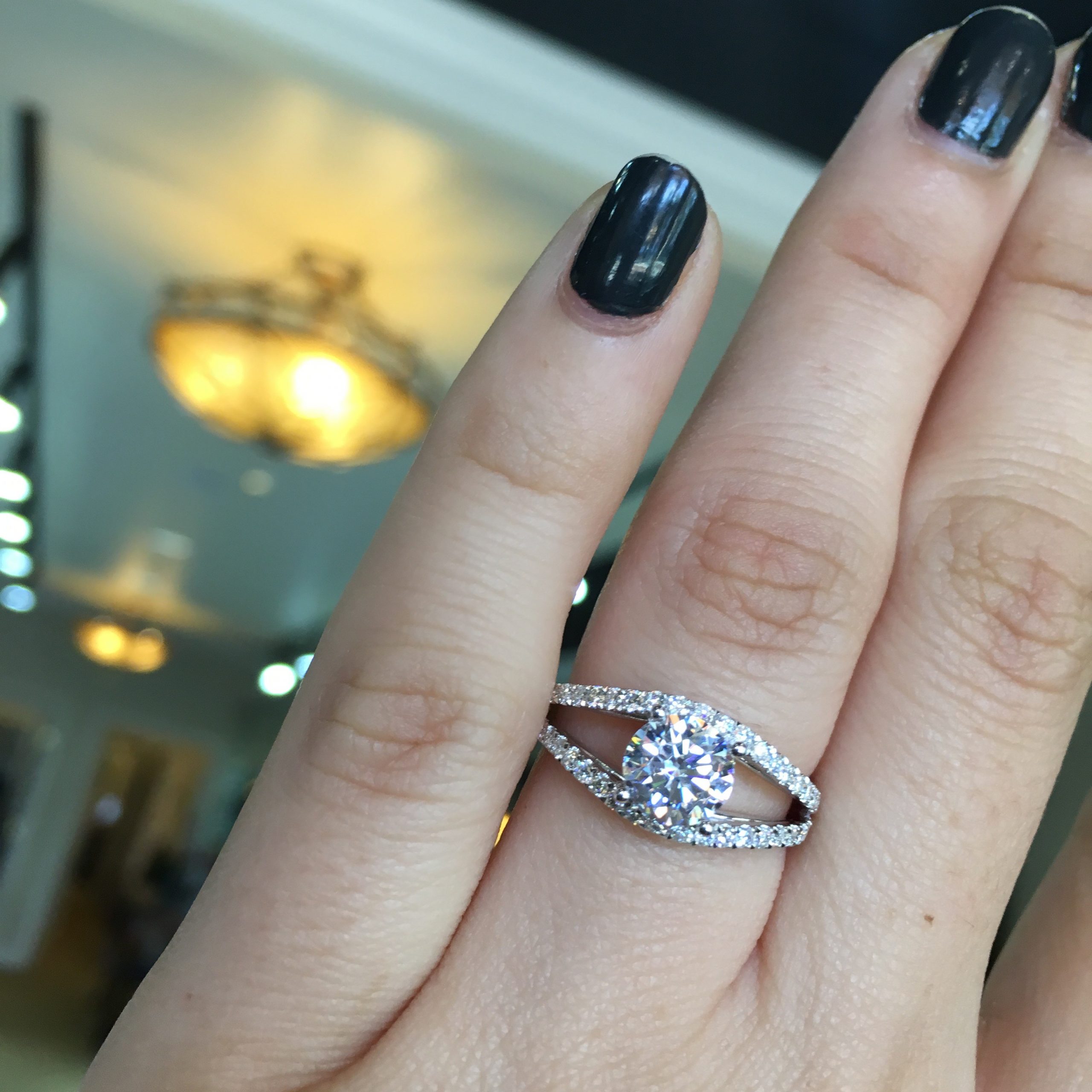 Alternative style engagement ring with a split shank embrace