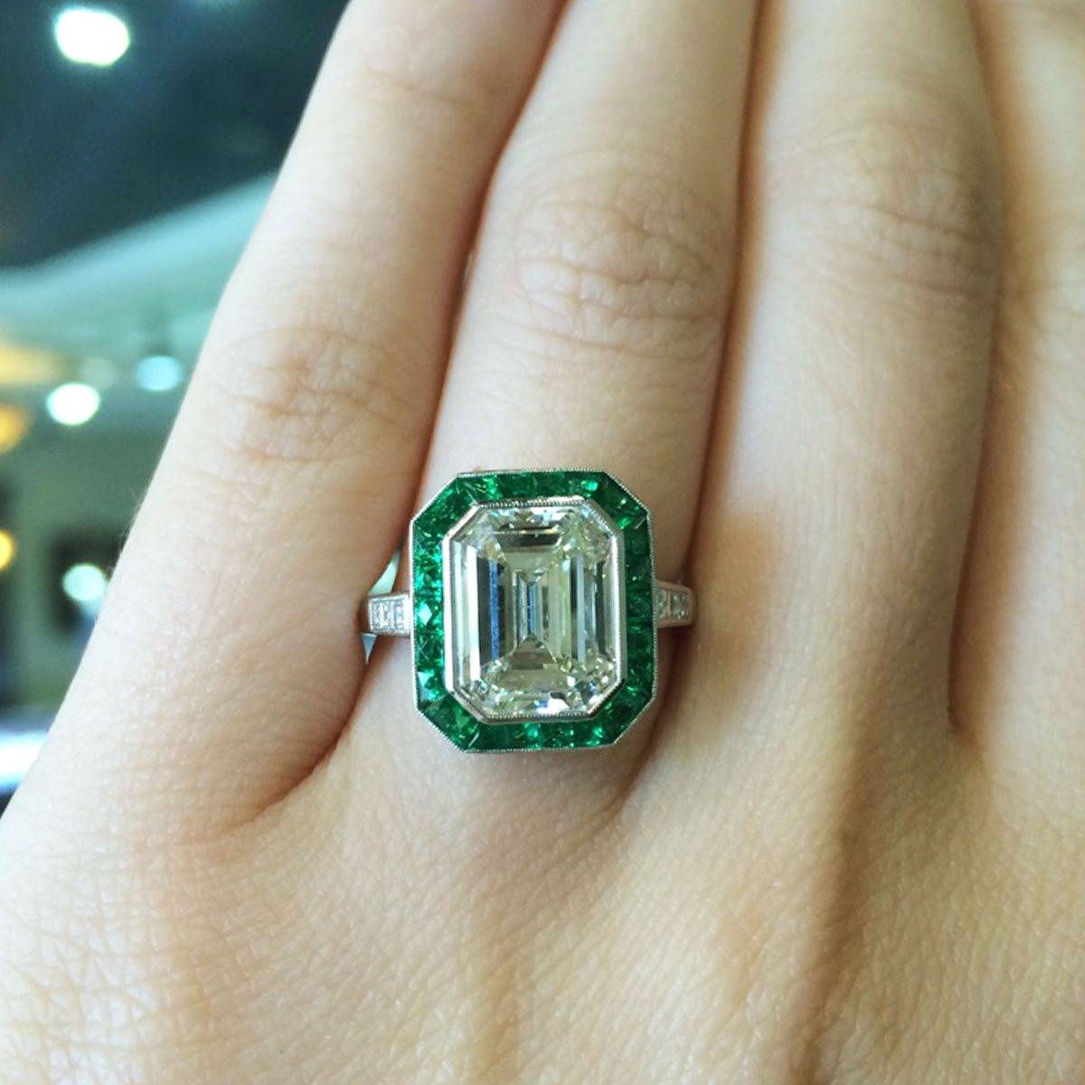 What's better than a double dose of emeralds? Emerald cut engagement ring with an emerald halo!