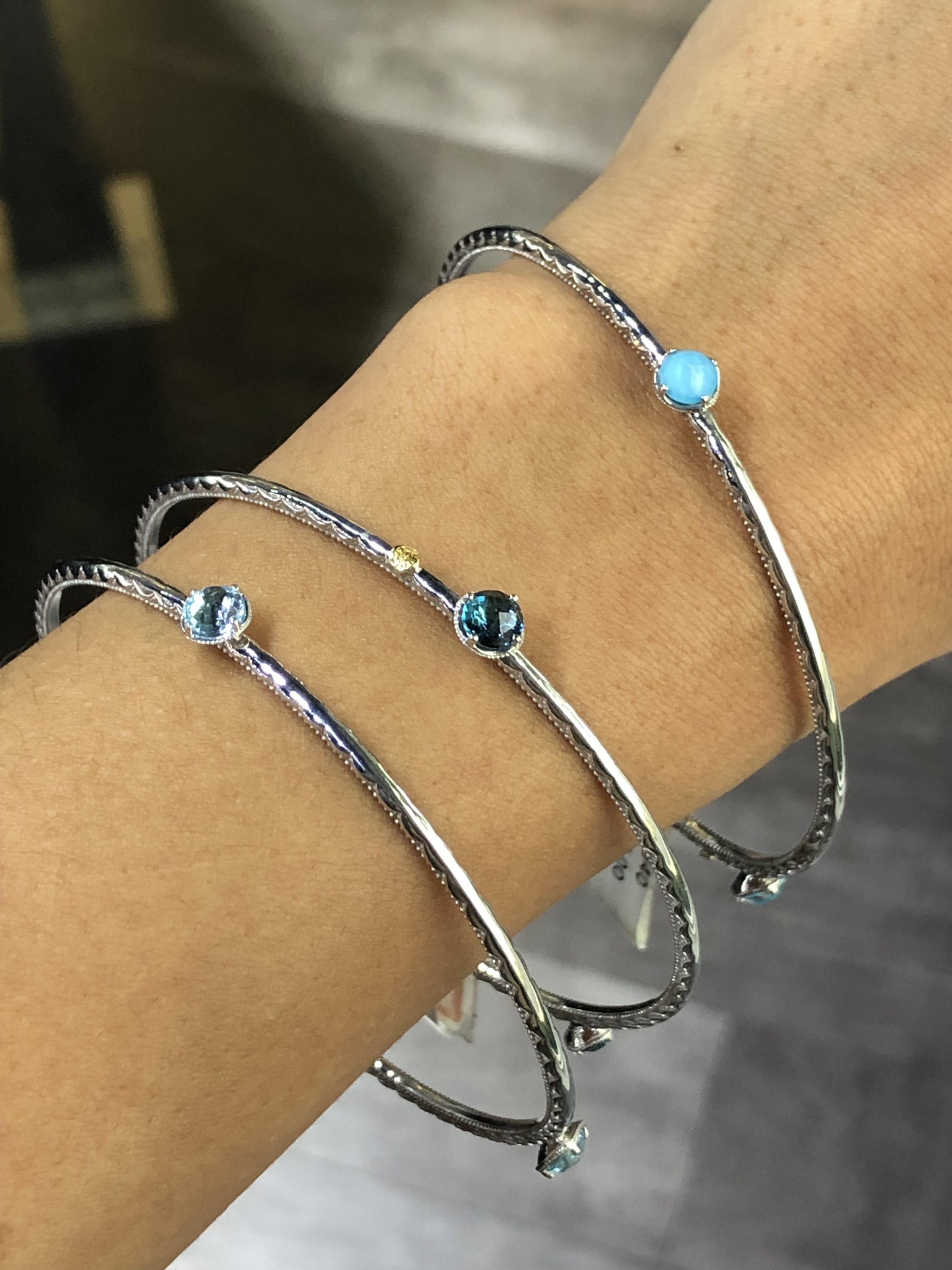three blue Tacori bracelets topaz and turquoise to go with White Jumpsuits 