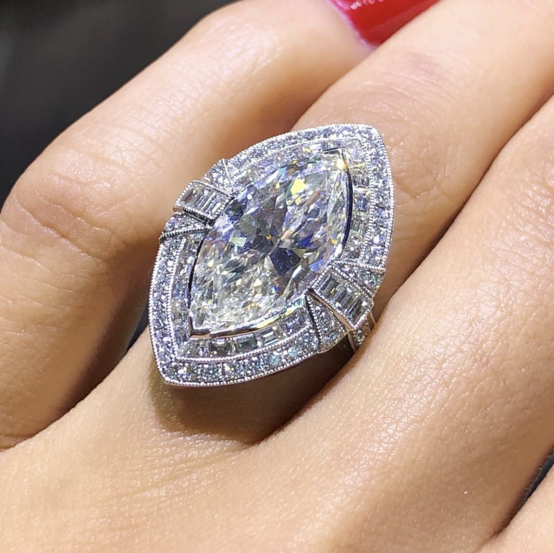 Marquise diamond engagement ring with diamond halo