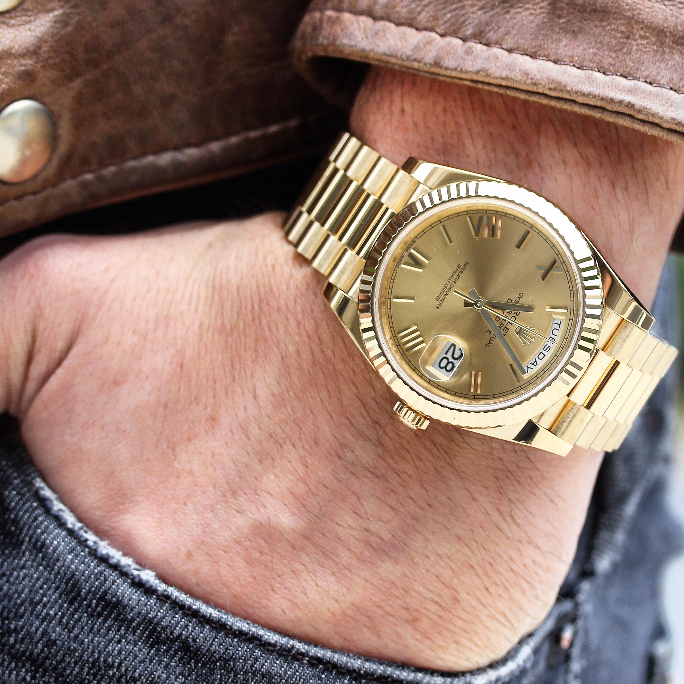 luxury watch vs smartwatch presidential rolex yellow gold on wrist