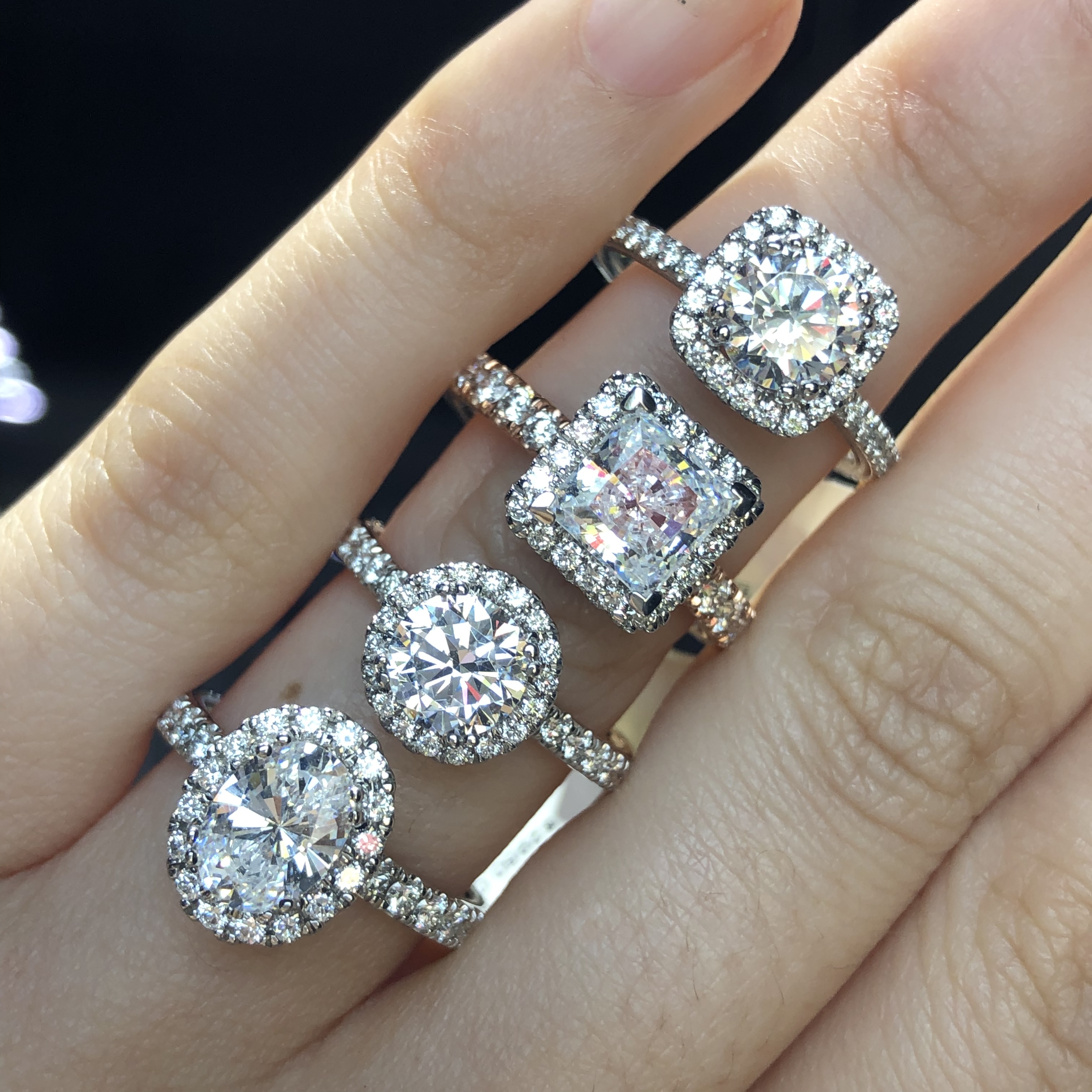 engagement ring buying four different diamond cut rings with halos