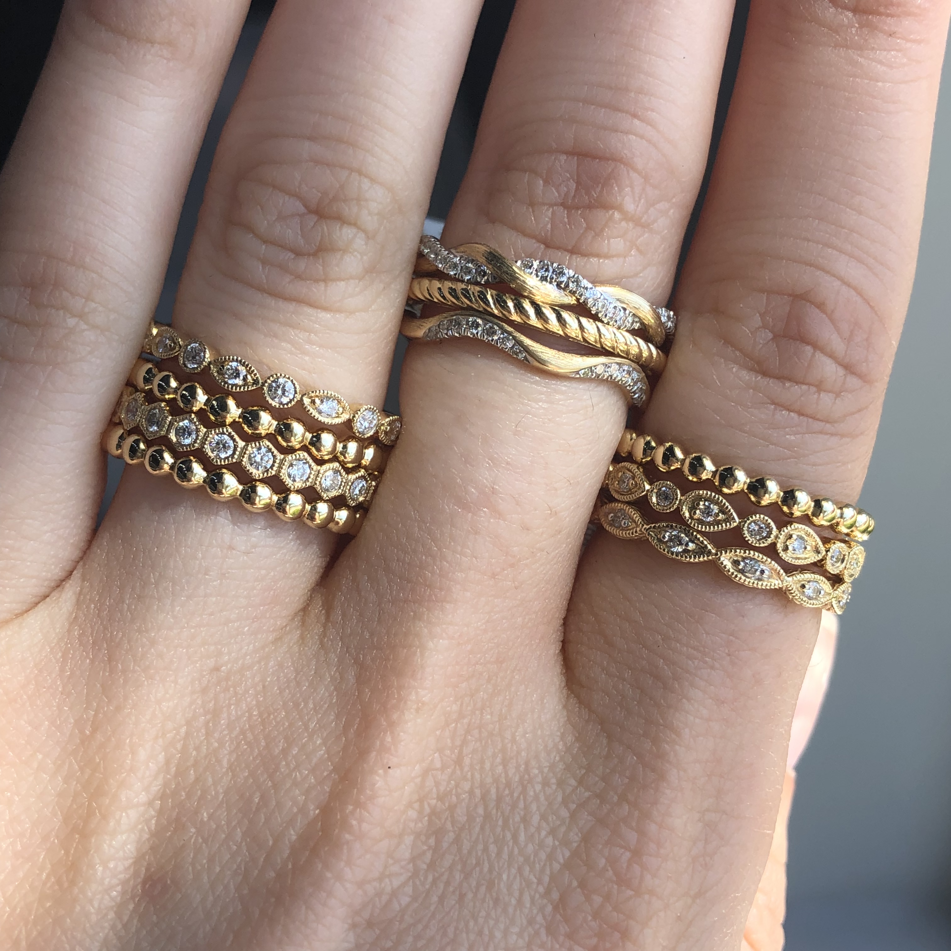 three stacks of yellow gold wedding ring