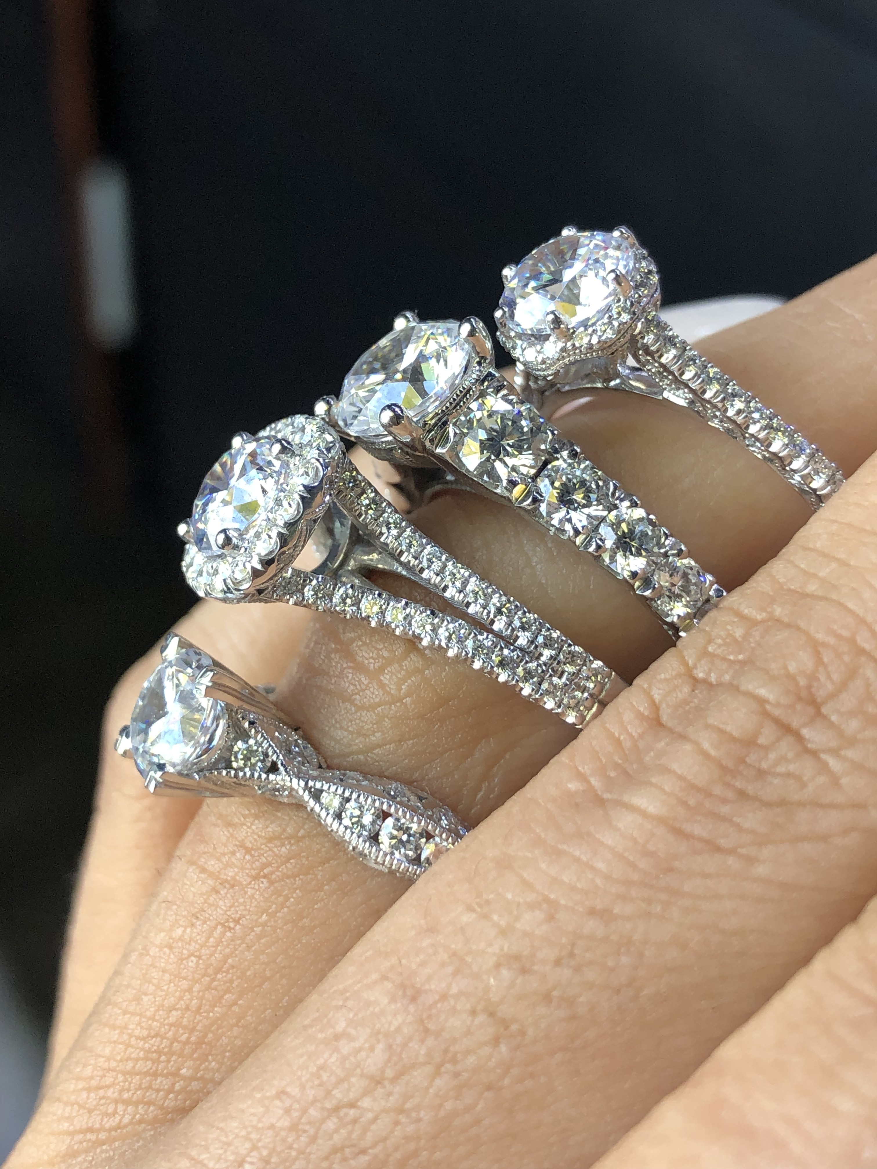 engagement vs wedding rings four engagement diamond solitaires close up 