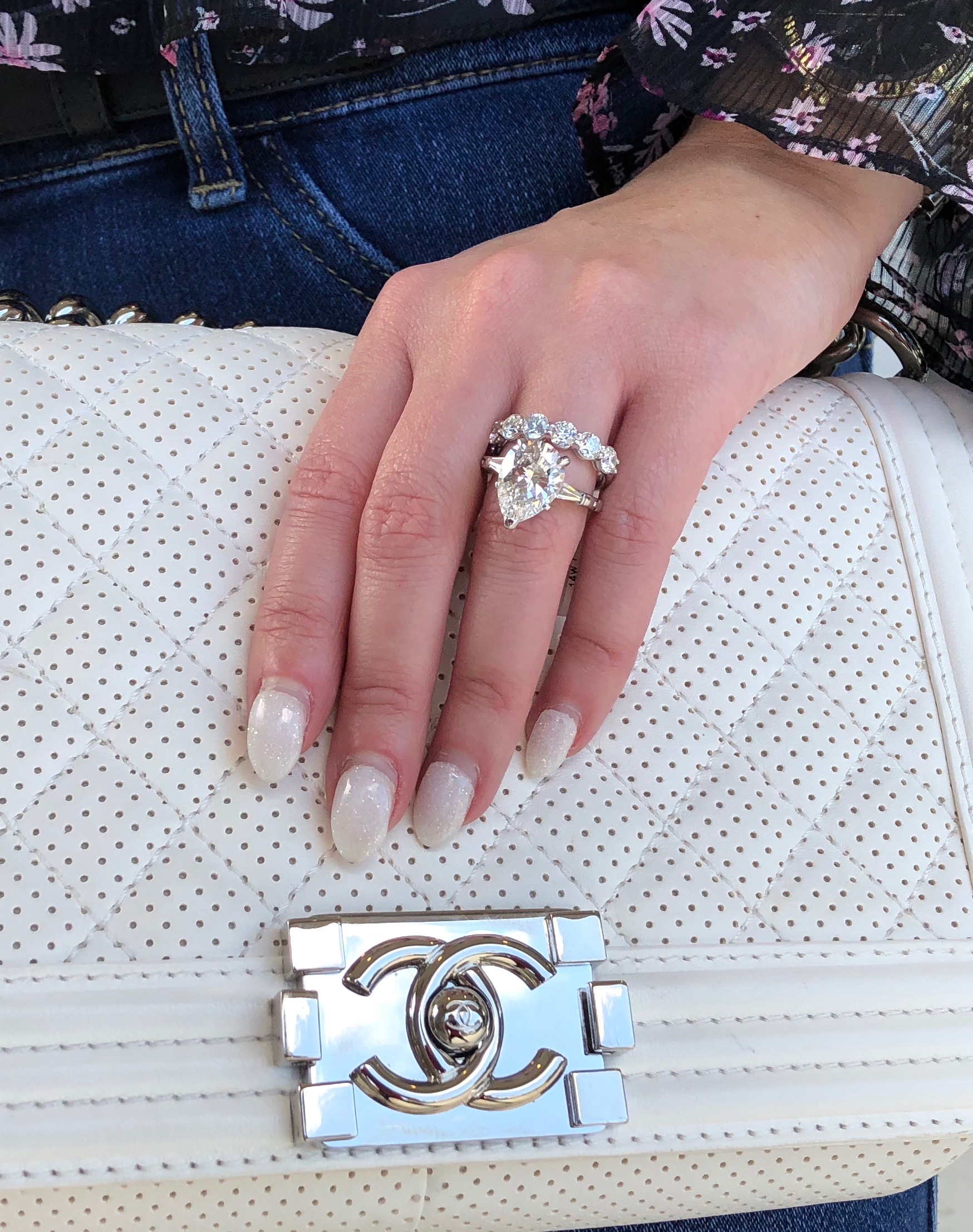 luxury jewellery diamond rings and white chanel handbag 