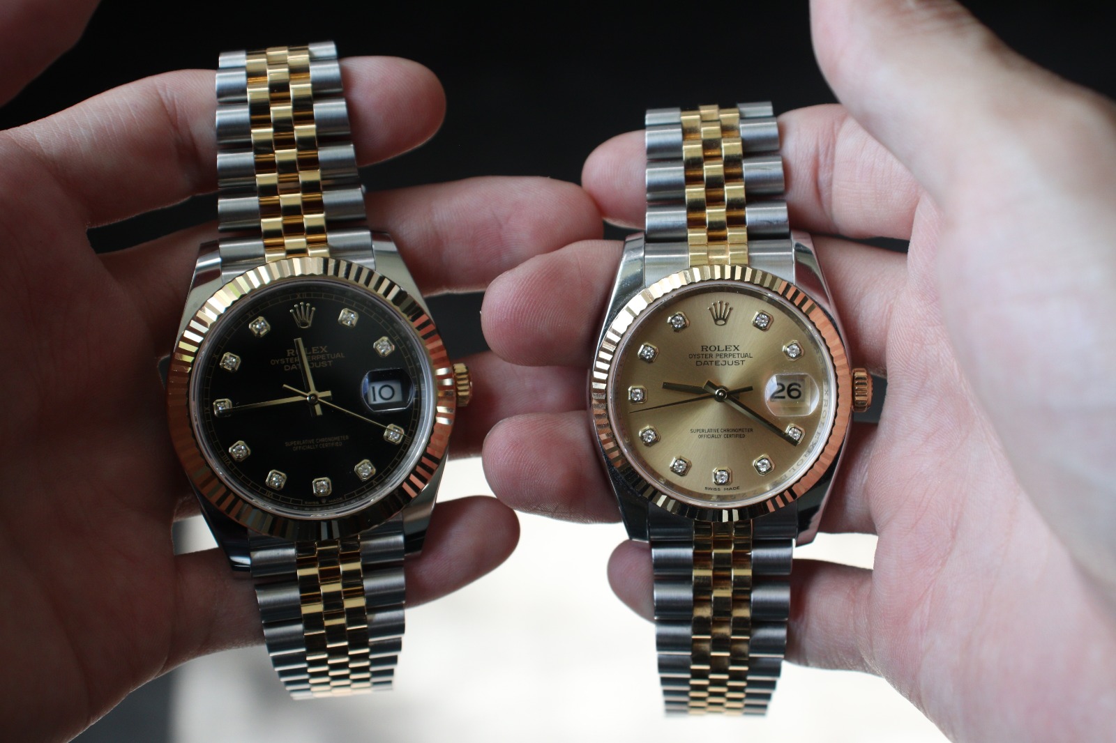 holding comparing rolex date just 116233 watches 36mm and 41mm black and gold dial