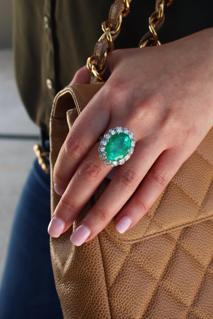 emerald ring with diamonds and chanel bag