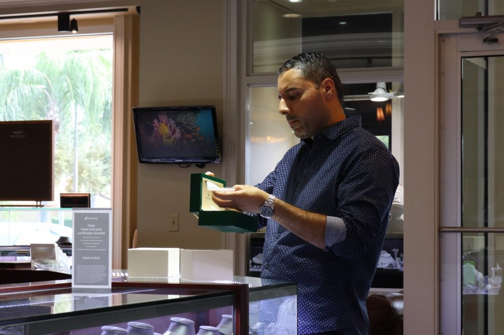 customer buying a rolex watch at diamonds by raymond lee