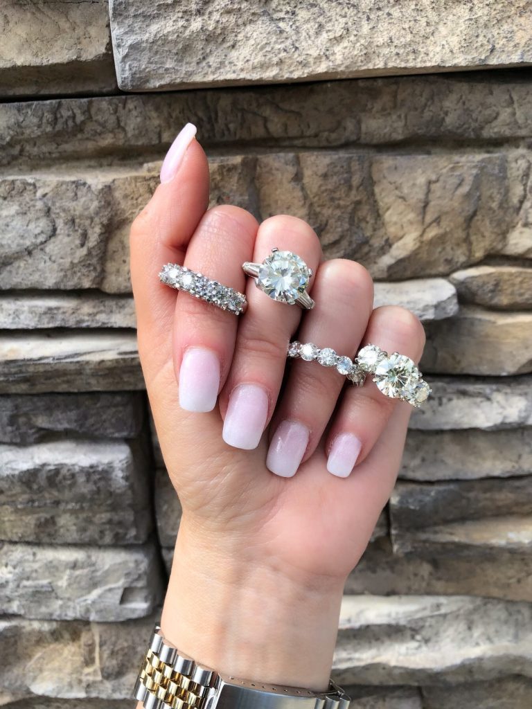 engagement rings for women worn alongside diamond bands