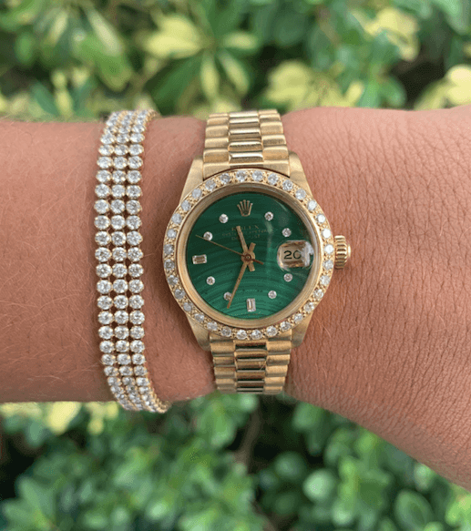 gold rolex with green dial and diamond tennis bracelets