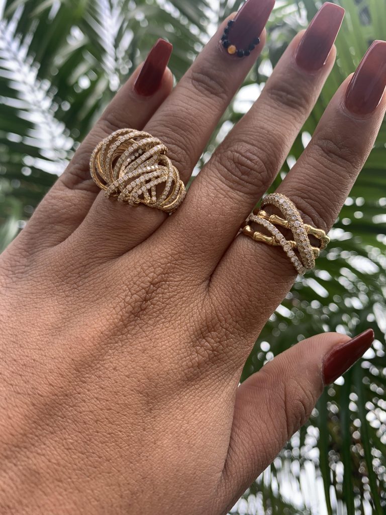 two gold jewelry rings