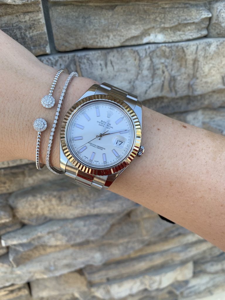 datejust rolex watch worn with bracelets
