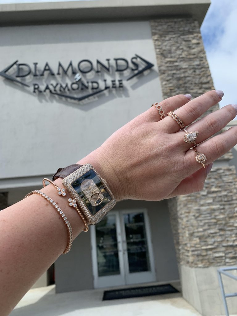 diamond jewelry and luxury watch in front of diamond jewelry store
