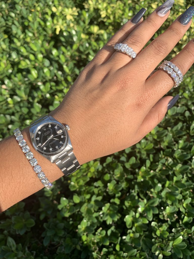 rolex datejust with roman numerals and diamond bracelet and rings