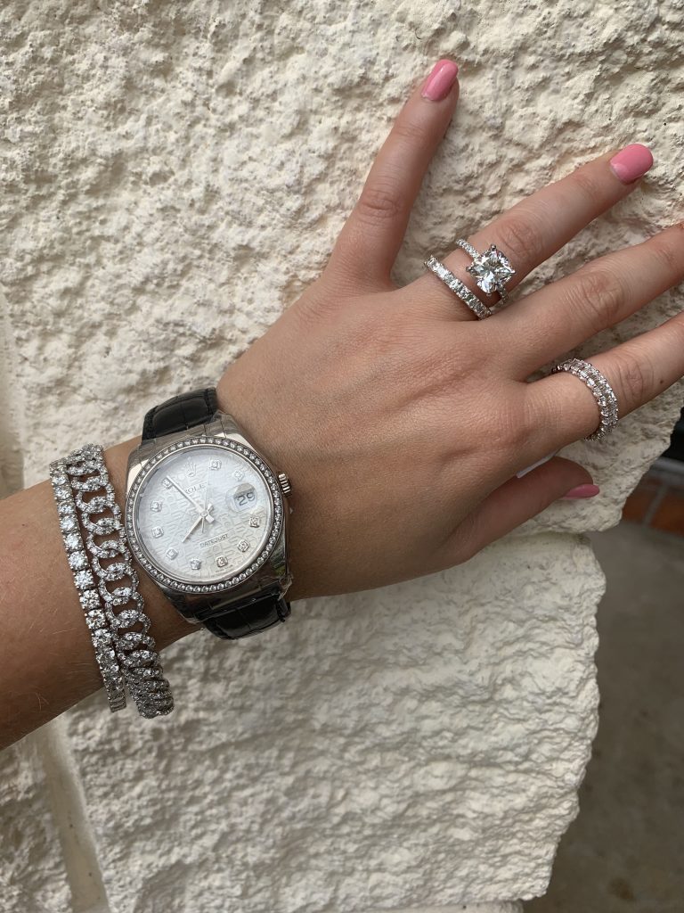Rolex watch worn with jewelry