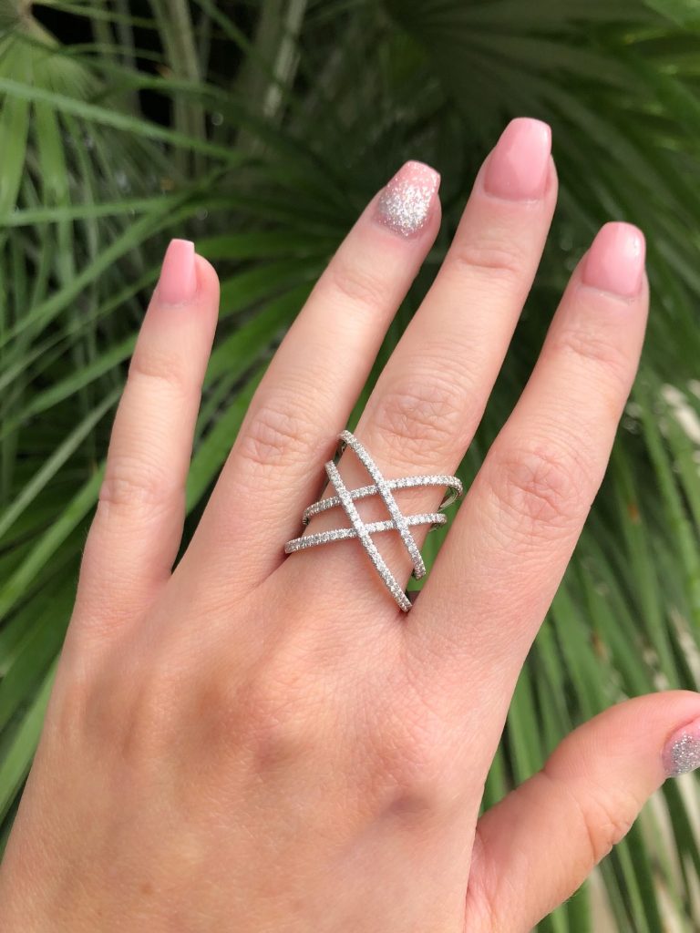cocktail ring worn on middle finger