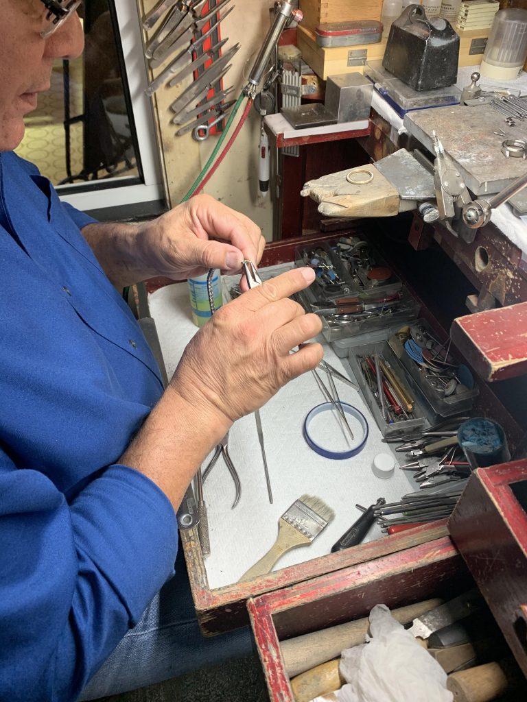 craftsman working at jewelry repair store in a jewelry repair near me