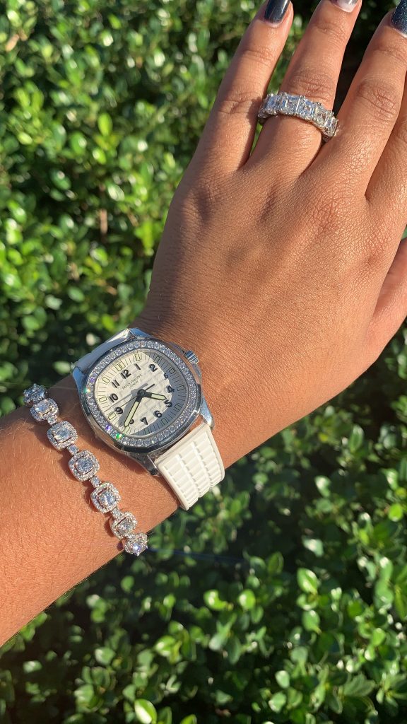 diamond jewelry worn with a patek philippe diamond bezel watch showing why jewelry is the best gift for valentine's day