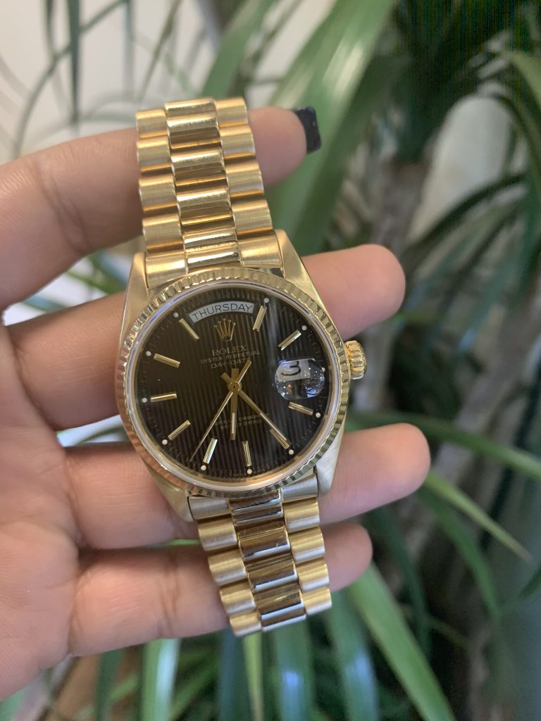 Rolex black dial on sale gold