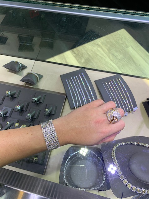 store where to buy diamonds showing glass case and tennis diamond bracelet