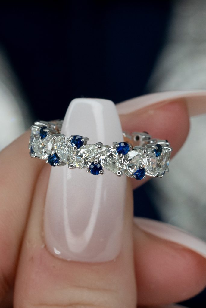 the round cut blue sapphire in a wedding ring