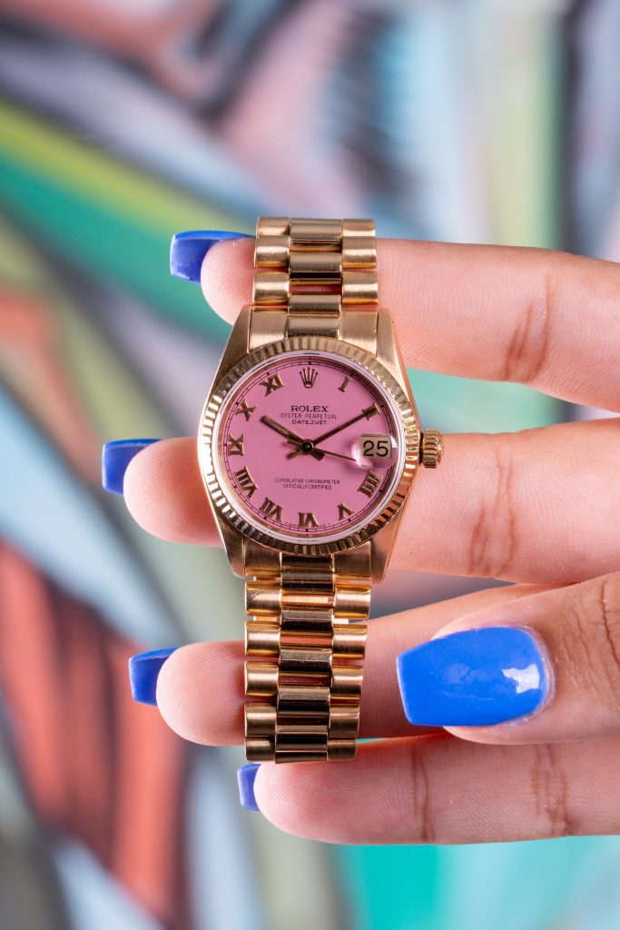 rolex datejust yellow gold pink dial front view