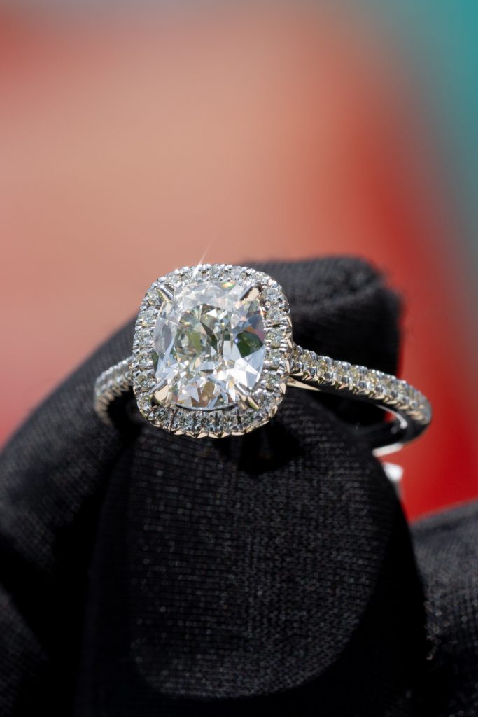 a cushion engagement ring with a halo setting